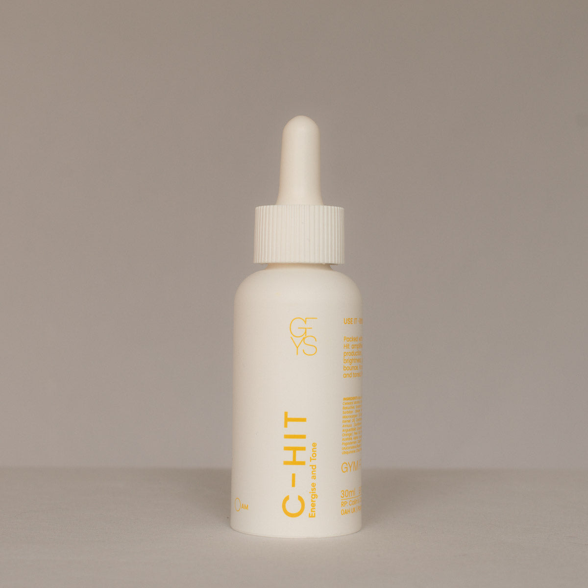 White dropper bottle C-HIT on a beige background