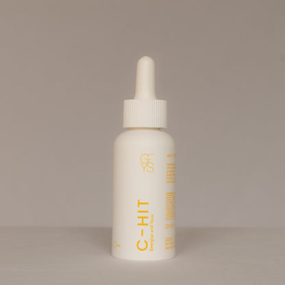 White dropper bottle C-HIT on a beige background